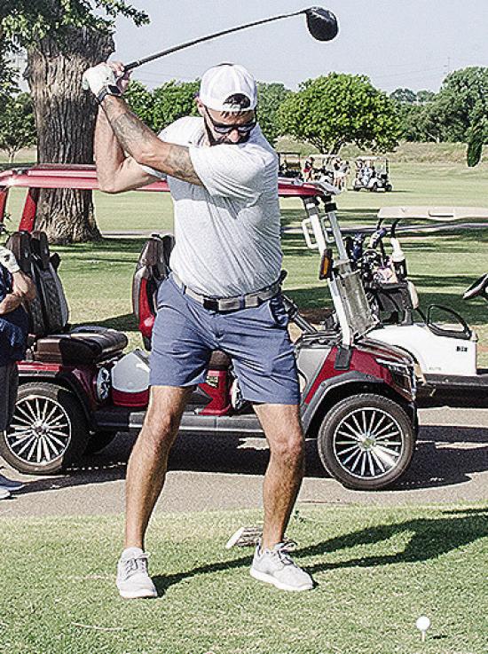 Roy Stucker focuses on the ball as he prepares to hit it Saturday during the Continue the Tradition Tournament at Riverside Golf Course. CDN | Sam Goodwyn
