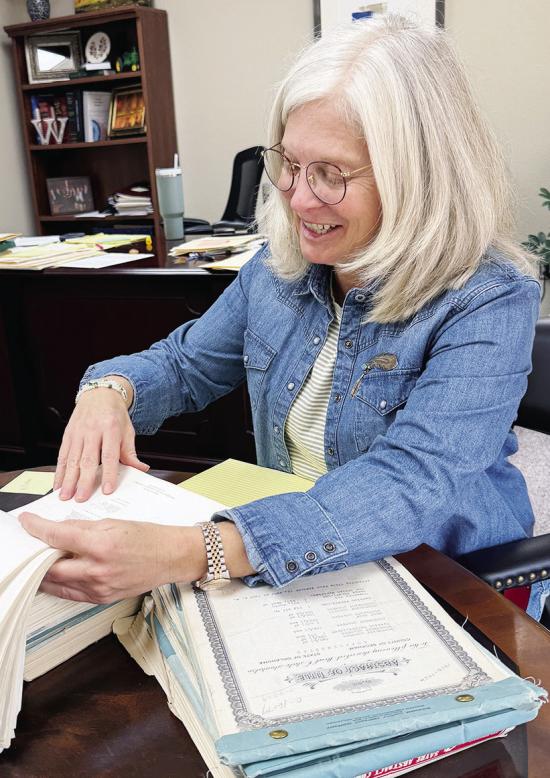 Jill Weedon goes over documents in her office. CDN | Shiann Dawson Jill Weedon goes over documents in her office. CDN | Shiann Dawson