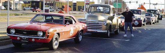 America’s Automotive Trust Communications Director Jake Welk steps out of just one of the several classic vehicles in a caravan stopping at the Oklahoma Route 66 Museum while traveling the entire length of Route 66 ahead of the car’s display at the De America’s Automotive Trust Communications Director Jake Welk steps out of just one of the several classic vehicles in a caravan stopping at the Oklahoma Route 66 Museum while traveling the entire length of Route 66 ahead of the car’s display at the De