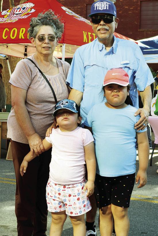 Maisyn Arvizo and Preslee Carrizales, front, with Juanita Carrizales and Jaime Carrizales visit the Farmer’s Market at Engleman Park. CDN | Christian Jacobsen