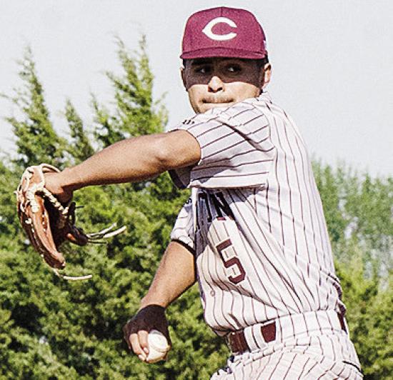 Clinton’s Jesus Gutierrez goes into his wind up as he prepares to pitch the ball during the Reds’ road win over Weatherford Monday in the “Custer County Conflict.” CDN | Sam Goodwyn