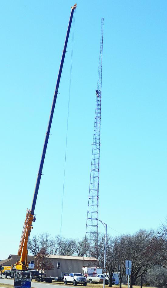 A crane was used to help workers disassemble pieces of the, now decommissioned, radio tower at the Oklahoma Highway Patrol Troop H Headquarters Monday afternoon. CDN | Micah Ashcraft