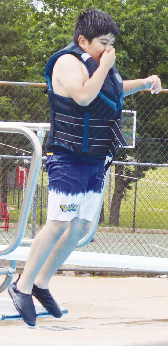 Aiden Perez jumps off of the diving board for the first time ever during Summer Playground at the Clinton Pool. CDN | Christian Jacobsen Aiden Perez jumps off of the diving board for the first time ever during Summer Playground at the Clinton Pool. CDN | Christian Jacobsen