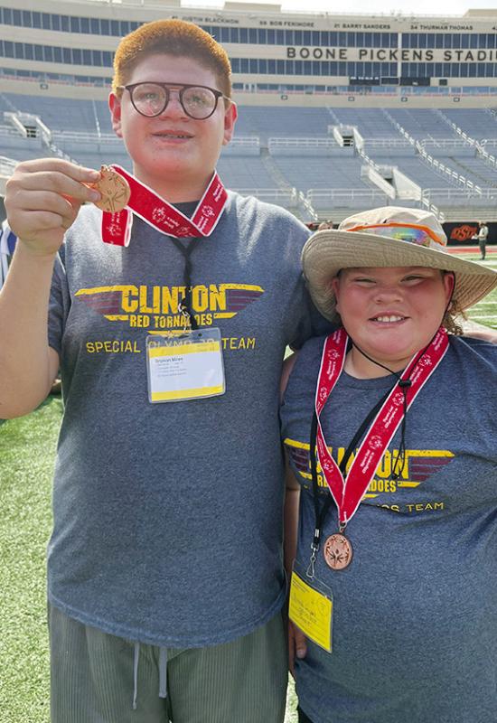 Kenneth Williams, left, and SJ Adkinson show off their bronze medals after competing in the Unified Bocce Ball at the Special Olympics Summer State Games last week at Oklahoma State University. CDN |Courtesy Photo