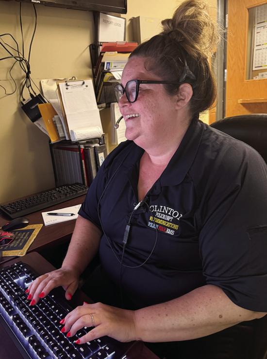 Dispatcher Gloria Kruer reviews officer locations during her shift. CDN | Shiann Dawson