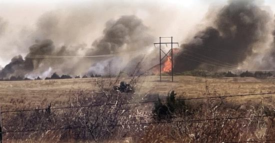 Homesteads near the Dripping Springs area watched wildfires come periously close around noon Sunday thanks to high winds stoking up the blaze. CDN | Courtesy photo