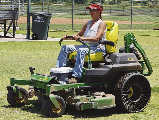 Sherrill Ausmus mows the grass at Schumacher Fields at Acme Brick Park Tuesday as the town prepares to host the OK Kids 8U Softball State Tournament starting today. CDN | Christian Jacobsen Sherrill Ausmus mows the grass at Schumacher Fields at Acme Brick Park Tuesday as the town prepares to host the OK Kids 8U Softball State Tournament starting today. CDN | Christian Jacobsen