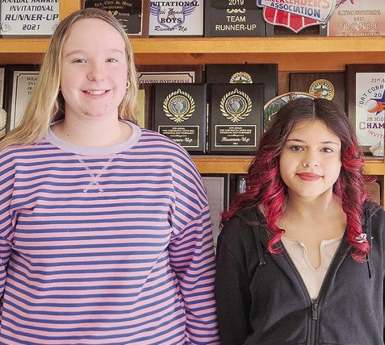 Clinton Middle School Spelling Bee runner-up Carli Patton, left, and winner Melanie Moy stand together after the competition winning word “hypnosis” was spelled. Moy will go on to represent Clinton Middle School at the district level. CDN | Courtesy p Clinton Middle School Spelling Bee runner-up Carli Patton, left, and winner Melanie Moy stand together after the competition winning word “hypnosis” was spelled. Moy will go on to represent Clinton Middle School at the district level. CDN | Courtesy p