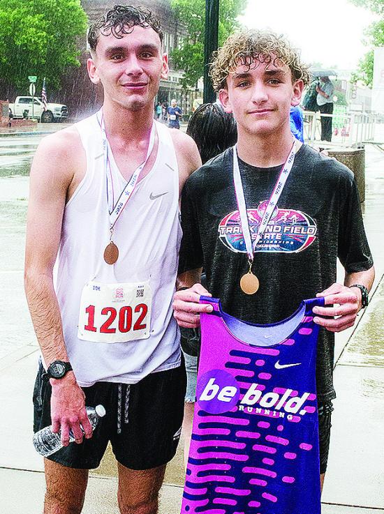 Xadrian Hernandez, left, smiles after winning the 10K portion of the Clinton, Classic Run Saturday and his brother Bentlee, right, smiles after taking first in the 5K portion of the event. CDN | Sam Goodwyn