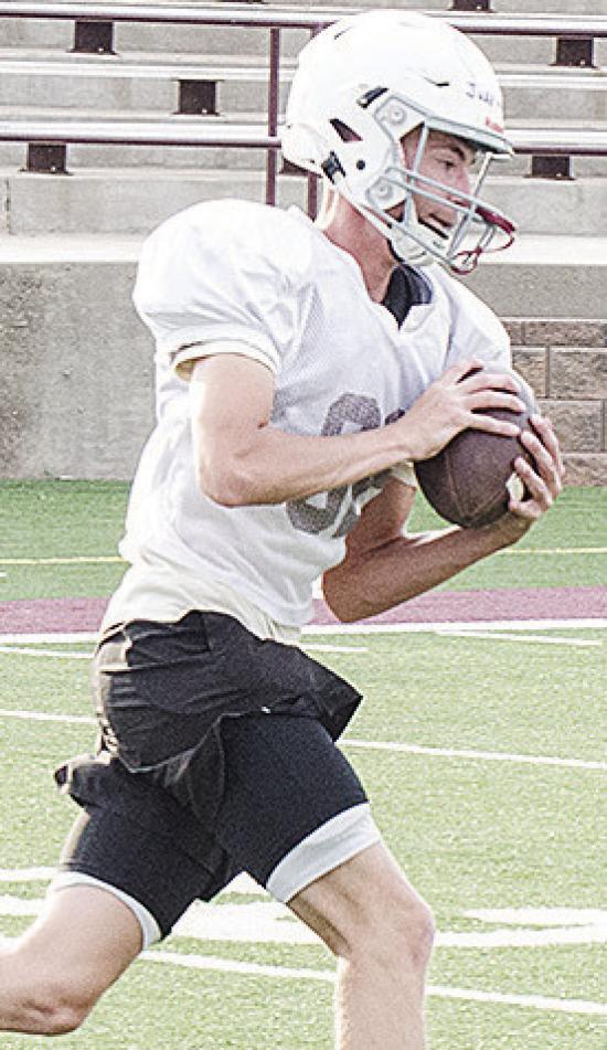 Clinton’s Judd Hall cuts upfield after catching the ball during spring practice in the Tornado Bowl. CDN | Sam Goodwyn