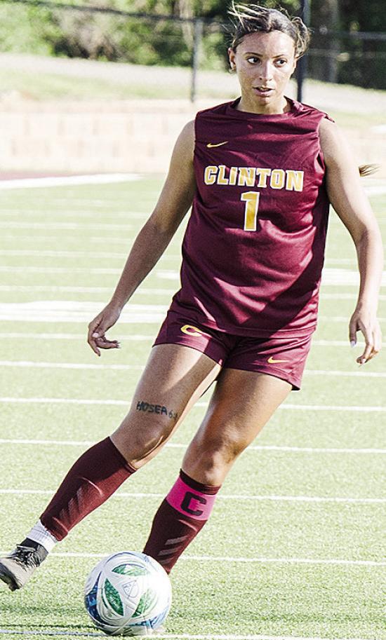 Clinton’s Alyvia Williams scans for an open teammate during the Lady Reds’ home win over Harding Charter. CDN | Sam Goodwyn