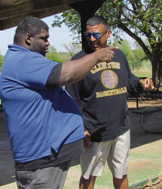 Johnny Brooks, left, and Art Lloyd talk about what the park will look like after replacing equipment at Joe Baker Park. CDN | Christian Jacobsen