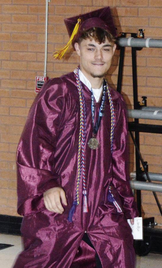 Landon Wilson heads toward center court for his graduation ceremony at the Tornado Dome. CDN | Christian Jacobsen