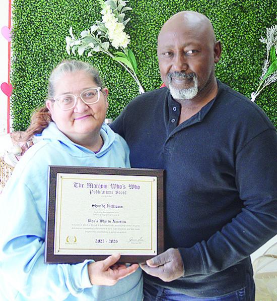 Shondra and Andre Williams of Nature’s Farm Girl show off their Marquis Who’s Who award. CDN | Courtesy photo