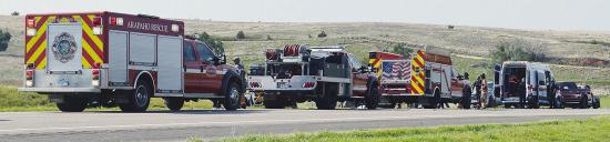 Emergency responder vehicles line up early Thursday evening along U.S. Highway 183 in an effort to administer aid to the victims of an alleged head-on collision. CDN | Christian Jacobsen