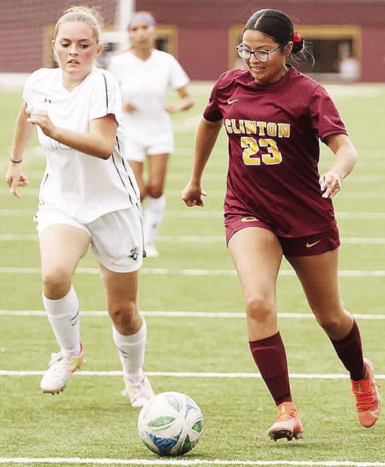 Clinton’s Audrina Trout, right, outraces the Elk City defender during the Lady Reds’ home game against the Elkettes in the Tornado Bowl. CDN | Steve Wheeler