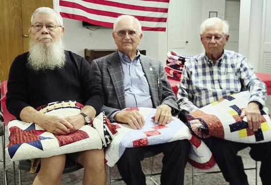 Veterans, from left, Denver Horn, Alfred Miller, and Larry Goeringer were recently presented with Quilts of Valor at Peace Lutheran Church in Bessie. CDN | Courtesy photo