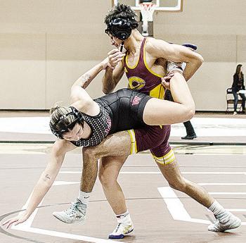 Clinton’s Brandon Rodriguez-Esclalante, right, performs a single leg takedown of his opponent during the Class 4A District 1 Duals Tuesday in Elk City. CDN | Sam Goodwyn
