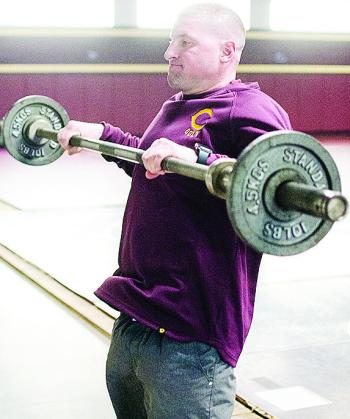 Clinton’s wrestling coach Rhett Blundell works out in the wrestling room over winter break. CDN | Sam Goodwyn