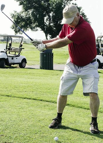 Mike Rollins begins his swing as he plays a round of golf at Riverside Golf Course. CDN | Sam Goodwyn