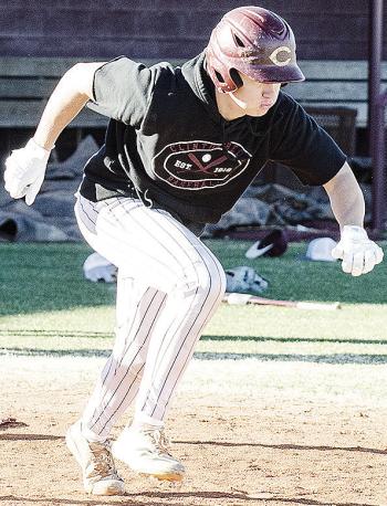 Clinton’s Vince Jones hustles away from home plate to first during a batting drill in baseball practice. CDN | Sam Goodwyn