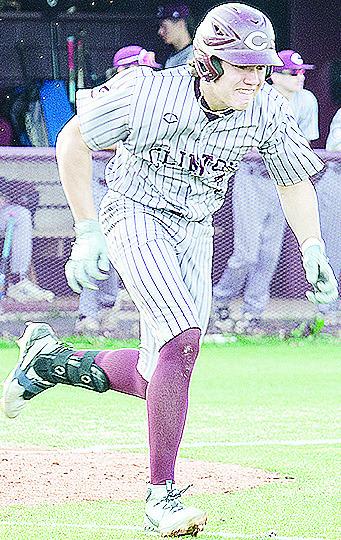 Clinton’s Easten Powell speeds toward first during the Reds’ win over Western Heights. CDN | Sam Goodwyn