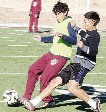 Clinton’s Miguel Zuniga Hernandez, left, and Luis Velez fight for the ball during practice in the Tornado Bowl. CDN | Sam Goodwyn