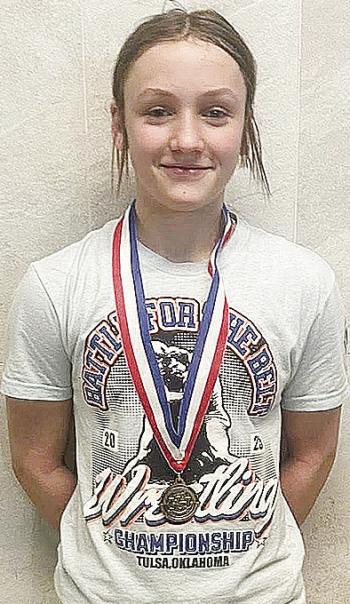 Clinton’s Kalley Fuller smiles after she finished fourth at the Junior High State Wrestling last week at the OG&amp;E Coliseum in Oklahoma City. CDN | Courtesy Photo