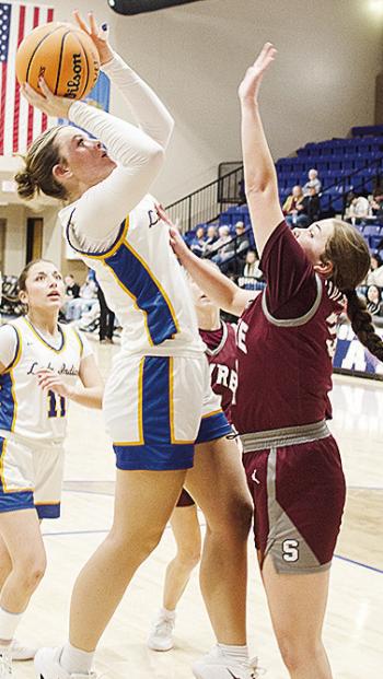 Arapaho-Butler’s Peyton Lambeth shoots the jumper over a Hammon defender while No. 11 Alivia Casas waits to help out in the Lady Indians’ win over Hammon in the first round of the Western Equipment Classic. CDN | Sam Goodwyn