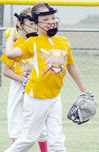Arapaho-Butler’s Kimber Lacy throws the ball back in during the Lady Indians’ first-round game against Elk City during the OK Kids Softball State Tournament at Schumacher Fields at Acme Brick Park. CDN | Sam Goodwyn