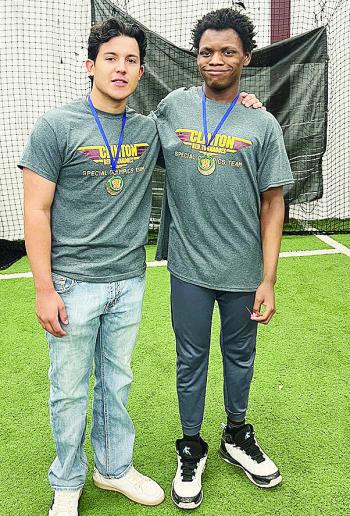 Sutton Hernandez, left, and Bryson Miles smile after competing at the Area Special Olympics Unified Bocce Ball Tournament at Clinton High School. CDN |Courtesy Photo