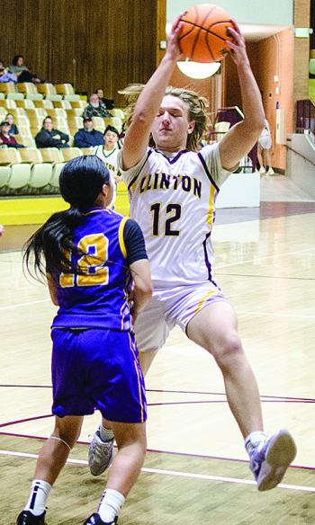 Eighth-grader Liam Lofland eurosteps around an Anadarko defender during the Whirlwinds’ game against the Warriors in the Tornado Dome. CDN |Sam Goodwyn