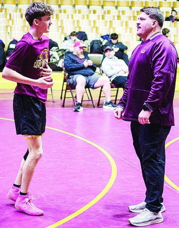 CDN | Sam Goodwyn Coach Austin Long, right, talks with Carsen Smith prior to the Hub City Tournament held at the Tornado Dome.
