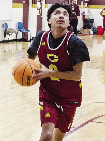 Clinton’s Ronnie Redshin focuses on the basket as he goes up for a layup during a practice in the gym at Southwest Elementary