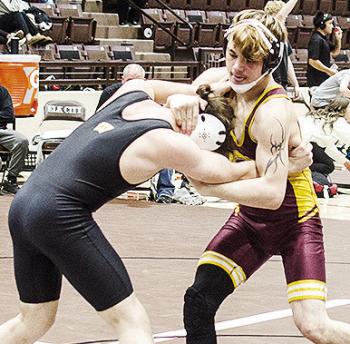 Clinton’s Landon Wilson, right, grapples with his opponent during the Class 4A District Duals Tuesday in Elk City. CDN | Sam Goodwyn