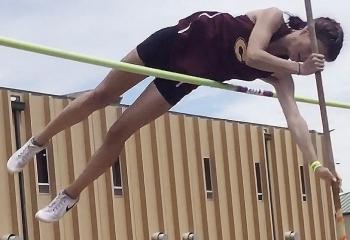 Clinton’s Gabby Hoffman vaults herself over the railing during the pole vault competition in the Class 4A State Track and Field Championship Meet this weekend in Catoosa. CDN | Courtesy photo