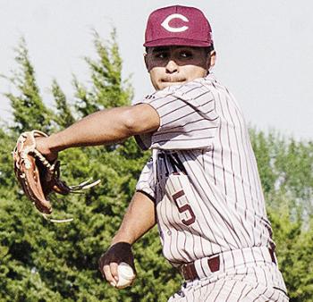 Clinton’s Jesus Gutierrez goes into his wind up as he prepares to pitch the ball during the Reds’ road win over Weatherford Monday in the “Custer County Conflict.” CDN | Sam Goodwyn