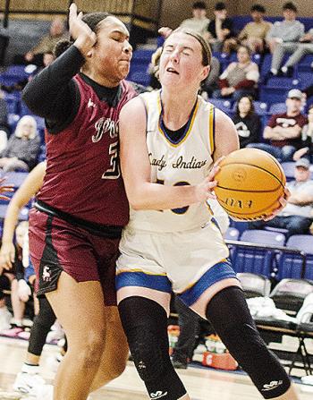 No. 10 Kelsey Garibay drives through a Pioneer-Pleasant Vale defender, as she heads toward the basket in A-B’s win over the Lady Mustangs Saturday to clinch the district championship. CDN | Sam Goodwyn