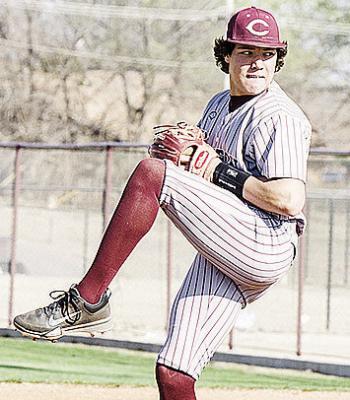 CDN | Sam Goodwyn Clinton’s Easten Powell kicks up his leg as he prepares to pitch against El Reno at home.