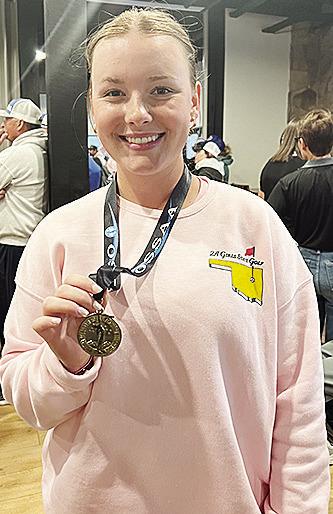 Corn Bible Academy’s Bentli Whitson shows off her medal after finishing ninth at the Class 2A State Tournament at Muskogee Country Club. CDN | Courtesy photo