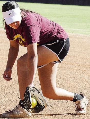 Clinton’s Jaeda Blackeagle fields the ball during preseason practice Tuesday at the softball field at the high school. CDN | Sam Goodwyn