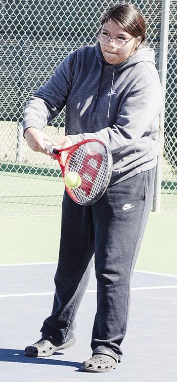 Makalya Bird return serves the ball during a recent practice at the Clinton High School tennis courts. CDN | Sam Goodwyn