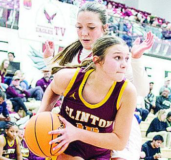 Clinton’s Hadley Meget fights through a Weatherford defender this season. CDN | Sam Goodwyn