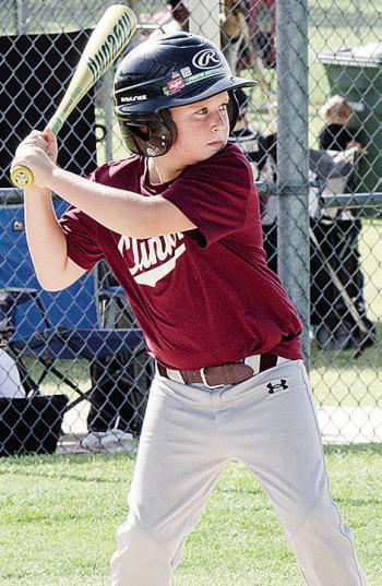 Layton Richmond focuses on the ball during his at-bat during Clinton’s baseball game in the OK Kids 8U Baseball State Tournament at Schumacher Fields at Acme Brick Park. CDN |Sam Goodwyn