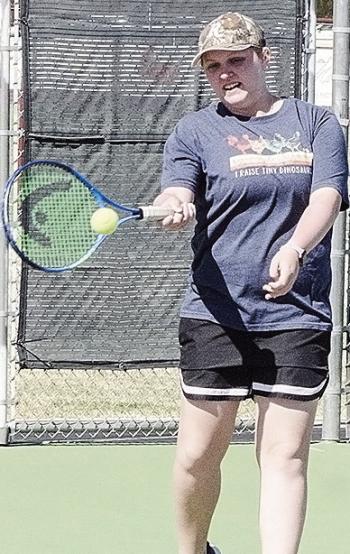Clinton’s Sami Hammans hits the ball back over the net during tennis practice at the high school. CDN | Sam Goodwyn
