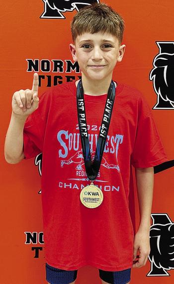 Mason Hileman smiles with his gold medal after placing first in the Southwest Regional Tournament that was held in Norman. He will wrestle at the OKWA State Tournament starting Friday in Oklahoma City. CDN |Courtesy Photo
