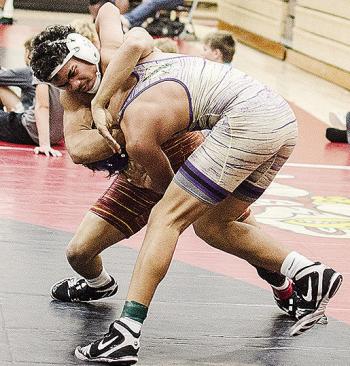 Clinton’s Tyson Brookter, left, grapples with his opponent during the Max Dippel Memorial Wrestling Tournament in Weatherford this season. CDN | Sam Goodwyn