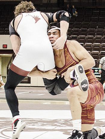Clinton’s Tyson Brookter attempts a single-leg takedown during the Class 4A District 1 Dual Tournament Tuesday at Elk City. CDN | Sam Goodwyn